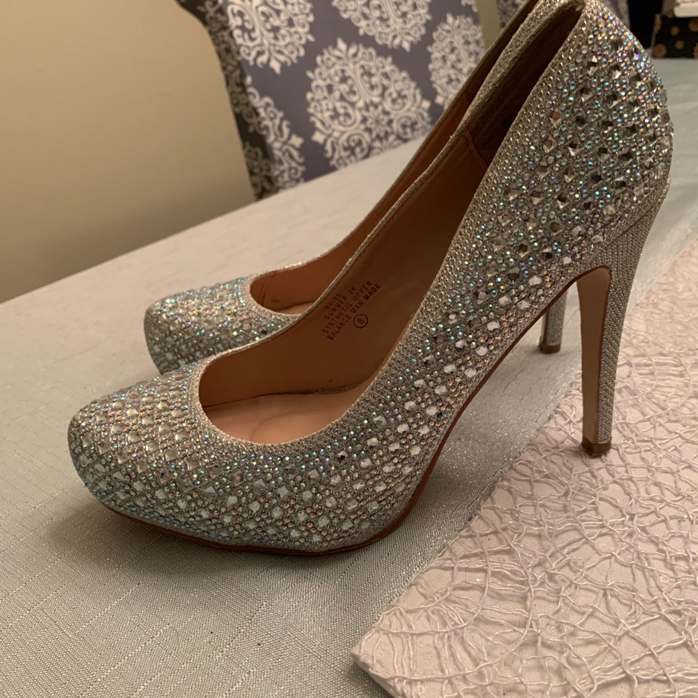 Silver Sparkly Size 8 heels.  Hardly worn.  Like brand new.